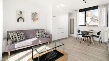 Deluxe Apartment, 2 Bedrooms, Terrace, City View | Living area | 43-inch Smart TV with digital channels