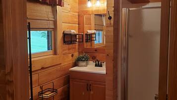 Shower, hair dryer, towels, toilet paper