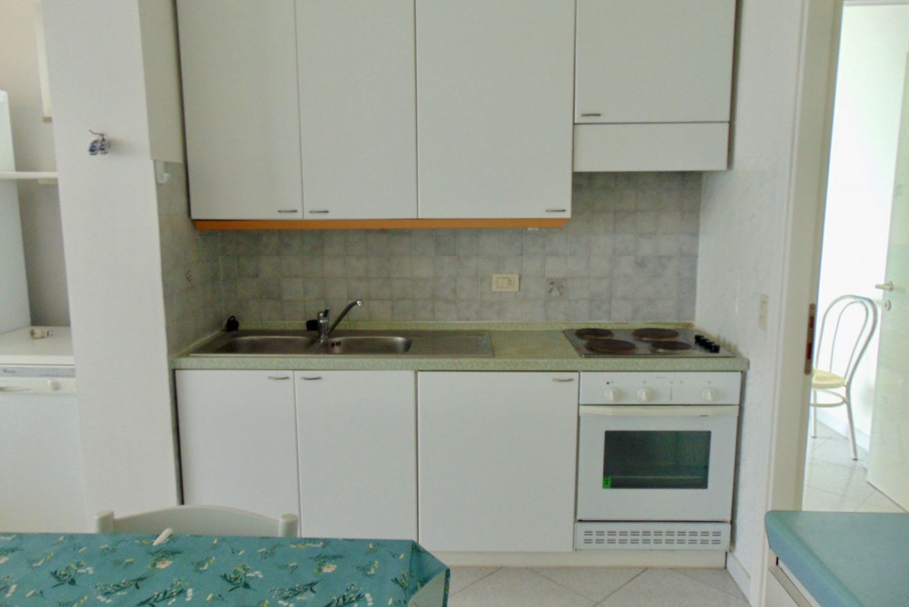 Fridge, oven, dishwasher, dining tables