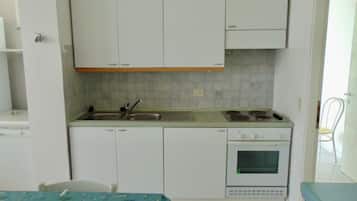 Fridge, oven, dishwasher, dining tables