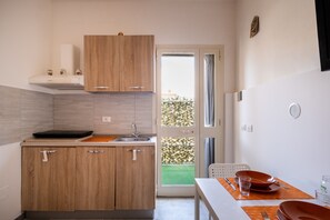 Fridge, stovetop, cookware/dishes/utensils