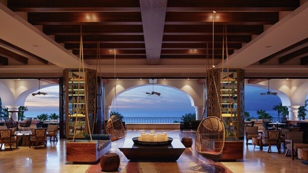 A spacious lobby with a view of the ocean, a bar area, and seating arrangements. - Los Cabos | Elevated Coastal Retreat | Pool + Beach (Cabo del Sol)