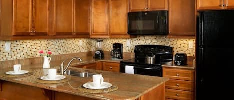 Coffee/tea maker, fridge, microwave, oven