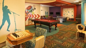A recreational room with a pool table, a billiards table, and a chess set. - Orlando | Upscale Disney Retreat | Pool + Parks (Orlando)