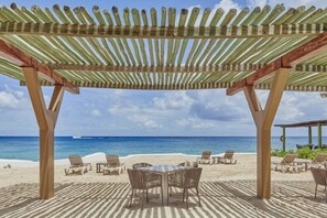 On the beach, sun-loungers, beach towels, scuba diving