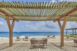 On the beach, sun loungers, beach towels, scuba diving