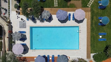 Seasonal outdoor pool, open 8:00 AM to 8:00 PM, pool umbrellas