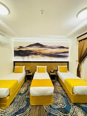 Habitación triple, 3 camas individuales | 1 dormitorio y ropa de cama de alta calidad
