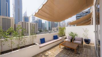 King Room With Private Terrace | In-room safe, desk, laptop workspace, blackout drapes