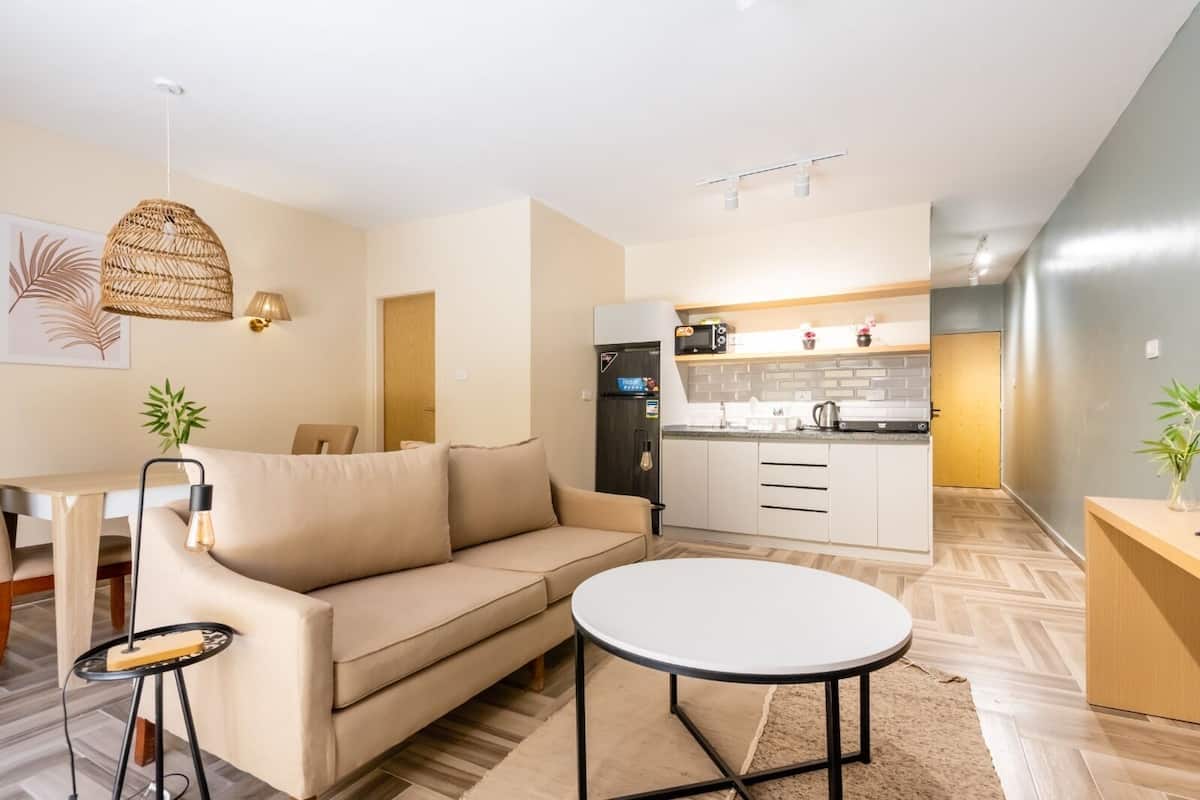 City Apartment, 1 Bedroom | Living area | 45-inch Smart TV with satellite channels