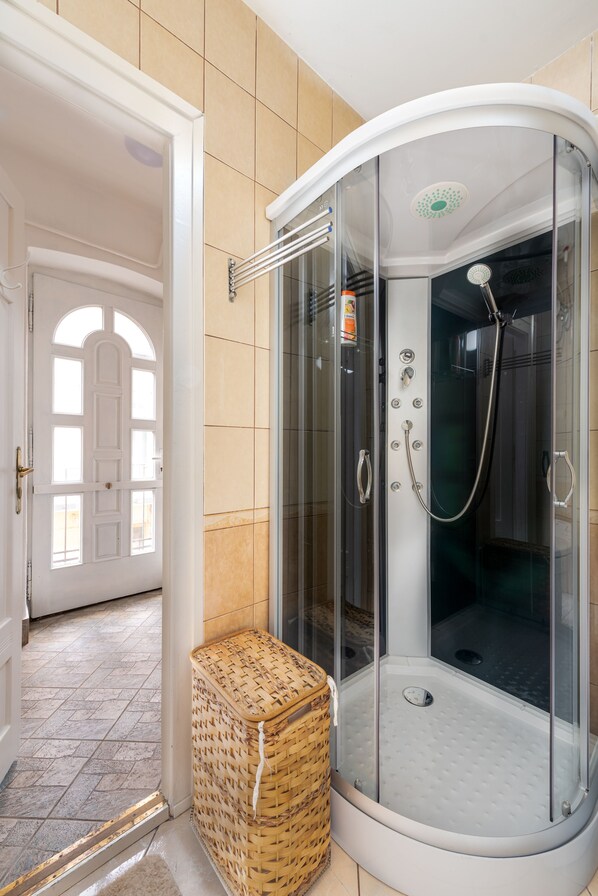 Shower, hair dryer, towels, soap
