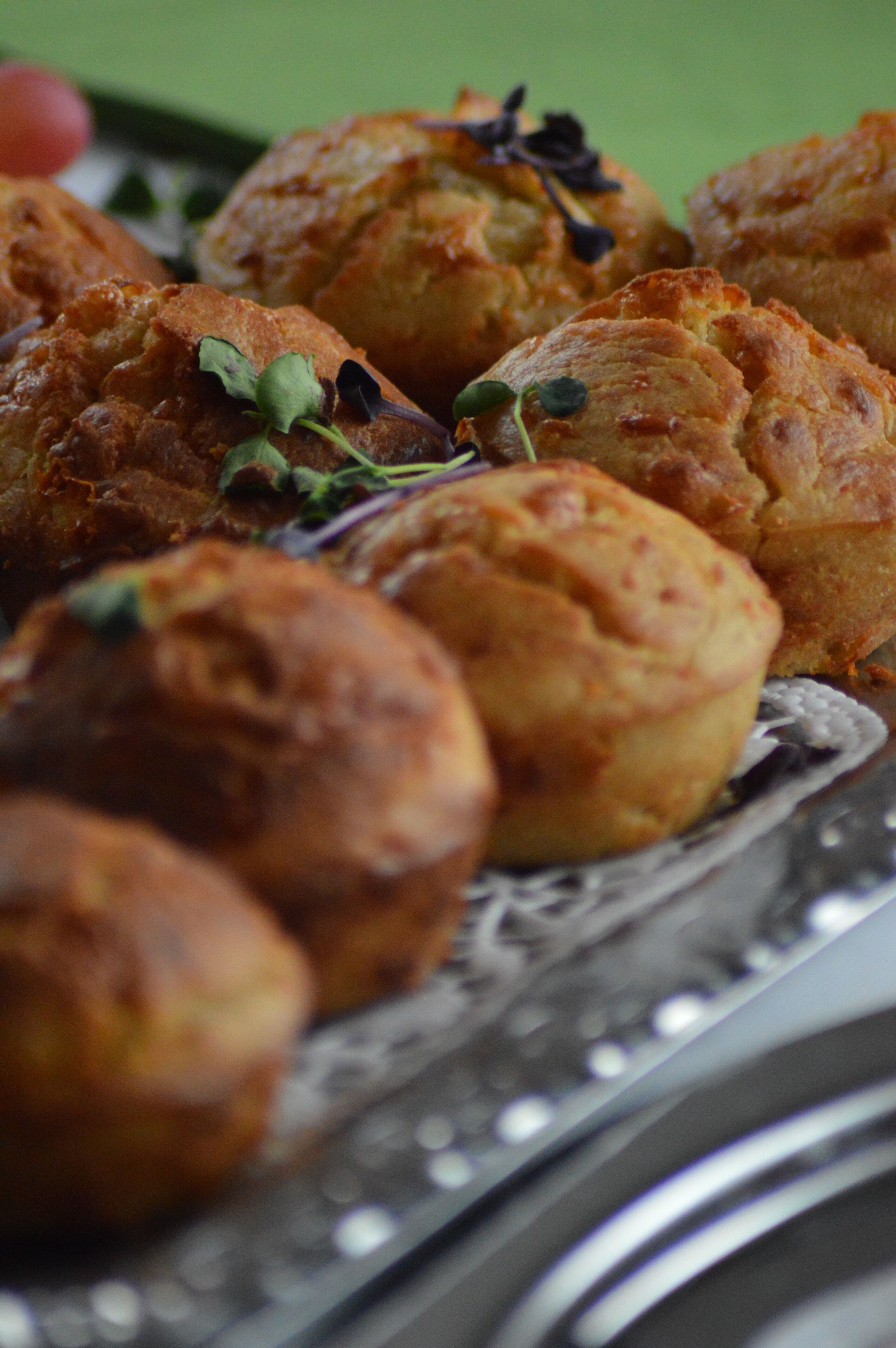 A close-up of baked goods on a silver platter.