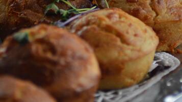 A close-up of baked goods on a silver platter.
