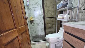 Shower, hair dryer, towels, soap