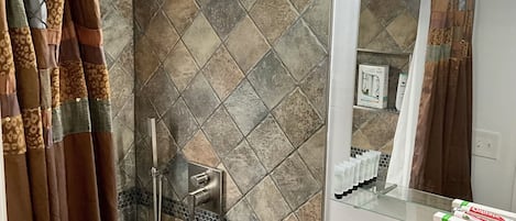 Shower, hair dryer, towels, soap