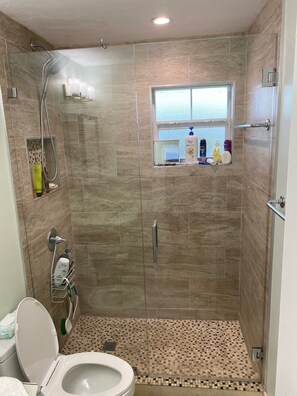 Shower, hair dryer, towels, soap