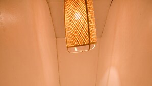 A wooden staircase with white railings leading to a room with a bed and a window. - Treasure Isle Backpacker's Hostel (Boracay Island)