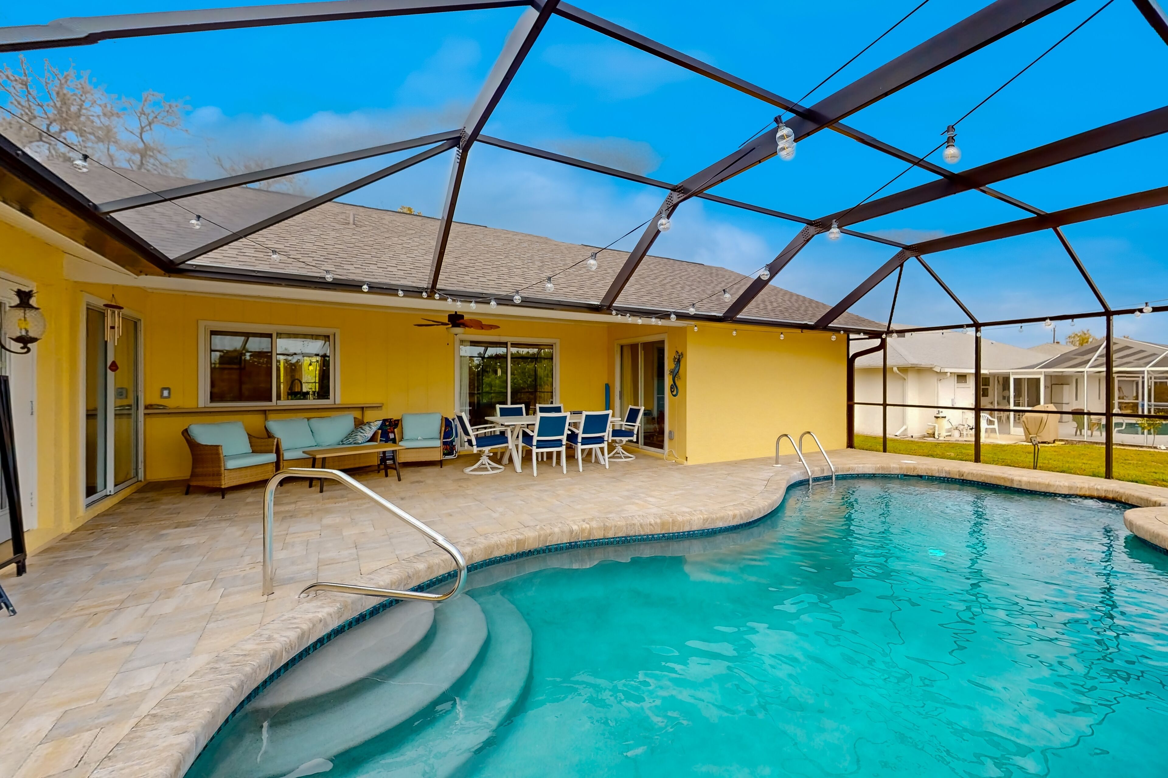 Renovated dog-friendly home near beach with private pool, screened lanai, grill