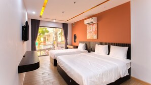 A hotel room with two beds, a TV mounted on the wall, an air conditioning unit, and a view of the outside through a large window. - Uyên Phương Hotel Nha Trang (Nam Nha Trang)
