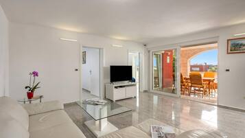 Family Apartment, Multiple Bedrooms (Apartment Ayni With Private Pool) | Living area | 21-inch flat-screen TV with satellite channels, TV