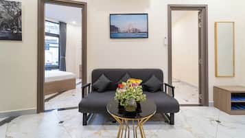 Premium Apartment, 2 Bedrooms, Ground Floor | Living area | 40-inch Smart TV with satellite channels, Netflix, streaming services