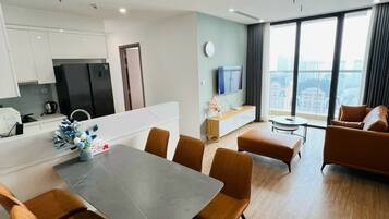 Luxury Apartment, 3 Bedrooms | Living area | 55-inch flat-screen TV with cable channels