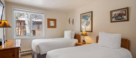 The second bedroom has two twin beds and a flat screen TV. The beds can be bridged to be one king with notice when you book.