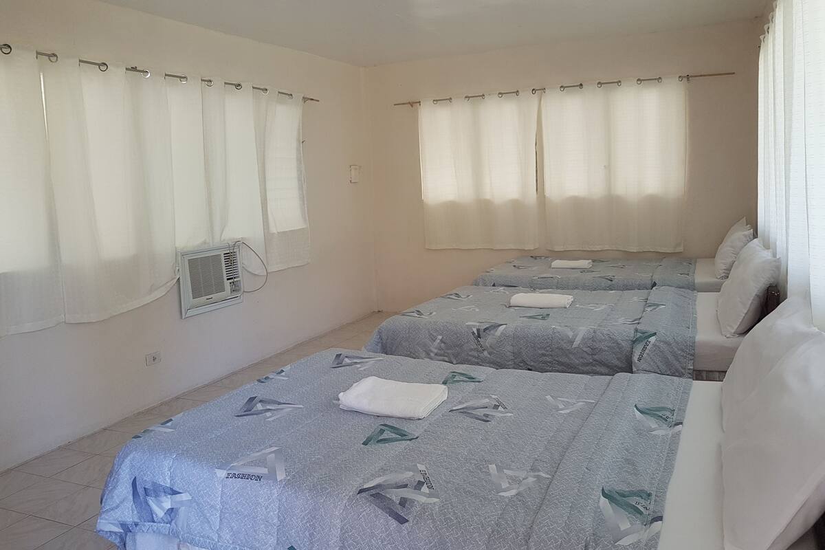 Family Room, Balcony, Beach View | Blackout curtains, iron/ironing board (on request)