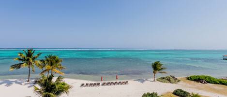 On the beach, sun loungers, beach towels