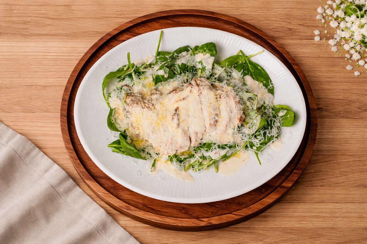 A plate of food on a wooden table.