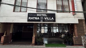 A two-story building with a sign for Hotel Ratna Villa, indicating it is an inn and restaurant. - RATNA VILLA INN (Darjeeling)