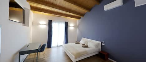 Premium bedding, down duvets, memory-foam beds, desk
