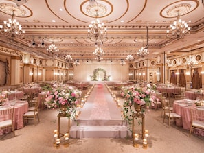 A grand ballroom with chandeliers, tiered seating, and floral centerpieces. - Grand Mercure Imperial Palace Seoul Gangnam (Seoul)
