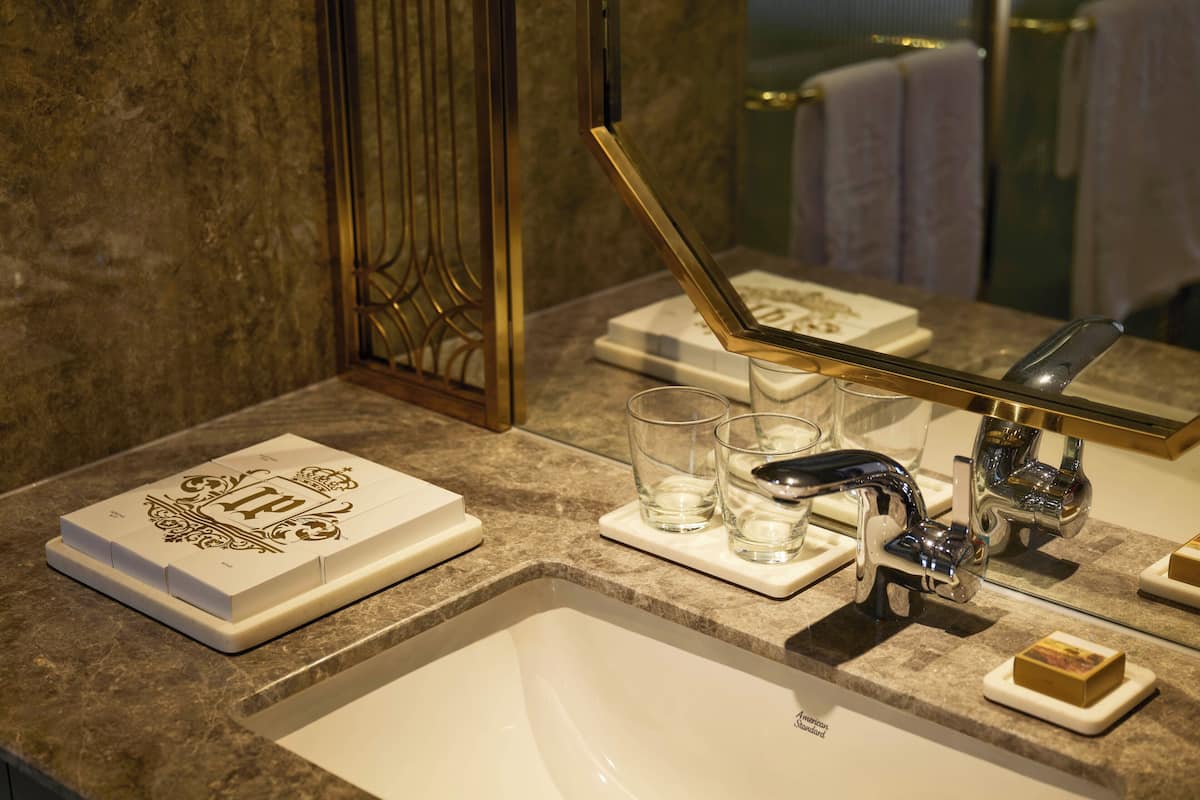 Separate tub and shower, designer toiletries, hair dryer, bathrobes