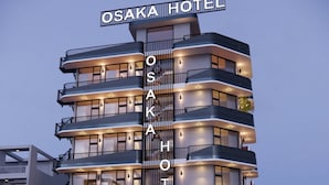 A multi-story hotel with a prominent sign reading "OSAKA HOTEL".