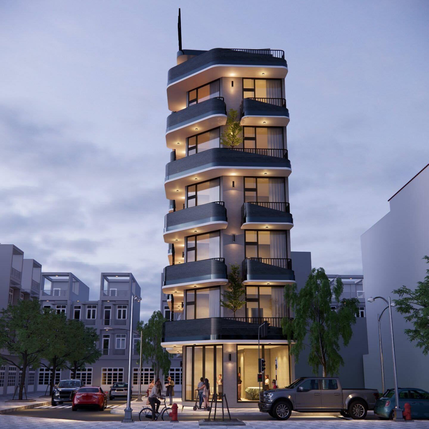 A modern multi-story building with balconies, large windows, and a ground-level entrance.