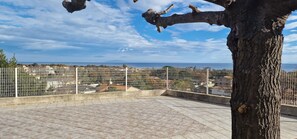 Enjoy breathtaking views of the sea from this outdoor terrace.