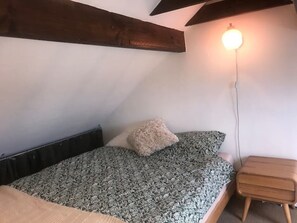 1 bedroom, desk, iron/ironing board, travel crib