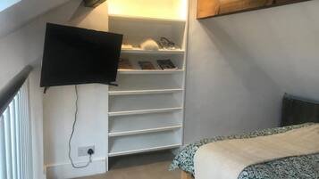 1 bedroom, desk, iron/ironing board, travel crib