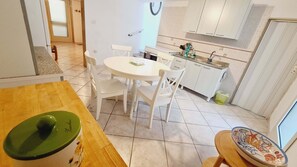 Apartment | Living area | 24-inch flat-screen TV with digital channels