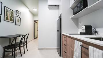 Fridge, microwave, stovetop, coffee/tea maker