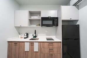 Fridge, microwave, stovetop, coffee/tea maker