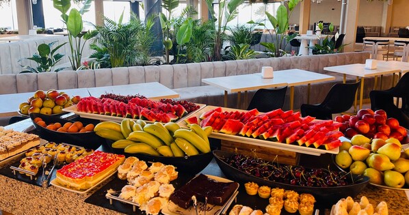 A buffet with various fruits and desserts. - STEAUA DE MARE - Olimp Resort (Olimp)