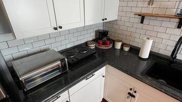 Fridge, microwave, stovetop, coffee/tea maker