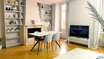 Panoramic Apartment | Living area | Flat-screen TV, fireplace