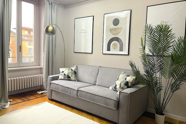 Panoramic Apartment | Living area | Flat-screen TV, fireplace