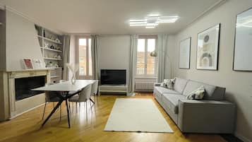 Panoramic Apartment | Living area | Flat-screen TV, fireplace