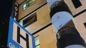 A hotel sign with a 'H' logo and the name 'Hotel Gran Imperio'. - HOTEL GRAN IMPERIO (Medellín)