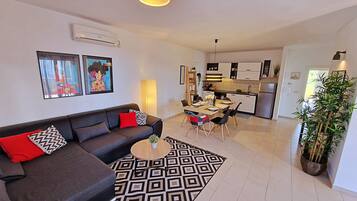 Family Apartment, 3 Bedrooms, Terrace, Sea View | Living area | 40-inch LCD TV with satellite channels