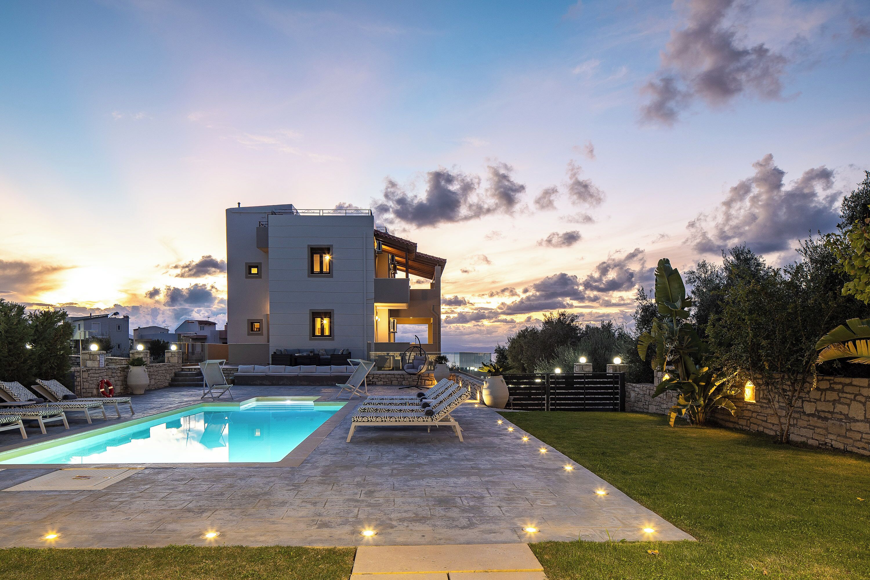 The pool area glows beautifully at night with ambient lighting